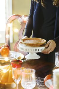 woman-serving-pumpkin-pie-at-the-thanksgiving-party-royalty-free-image-862347770-1539182061
